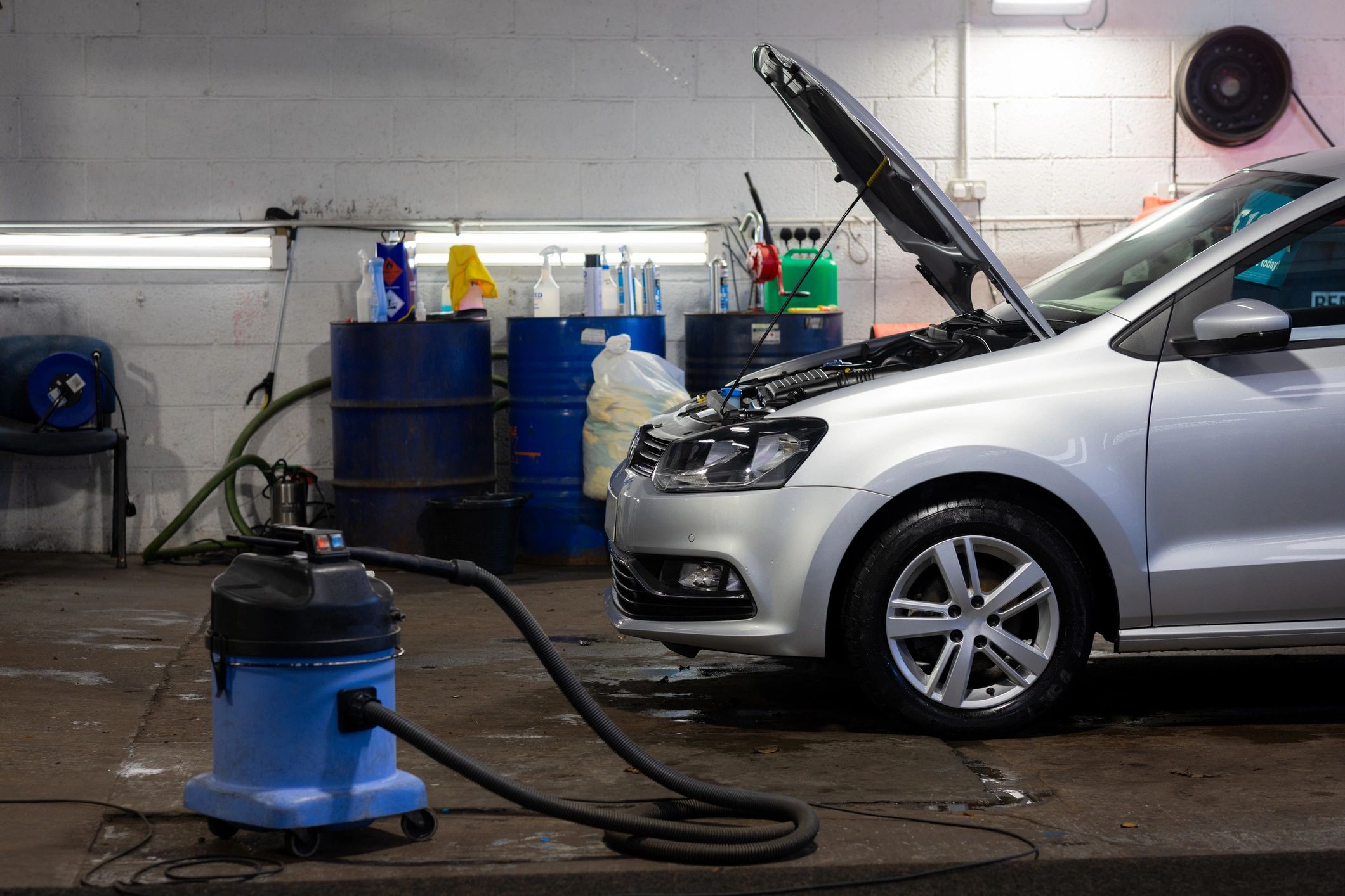 Vehicle being serviced in a detailing garage