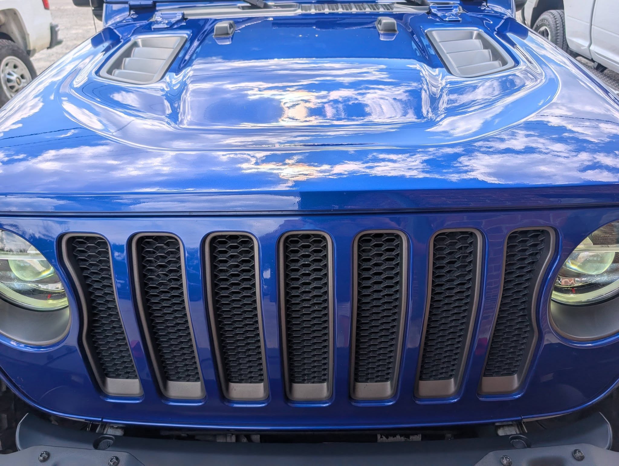 ceramic-coated-detail-blue-jeep-front-reflections-brunswick